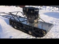 Мотобуксировщик LADOGA тёмно-чёрный бюджетный мотобуксировщик не для глубокого снега.  